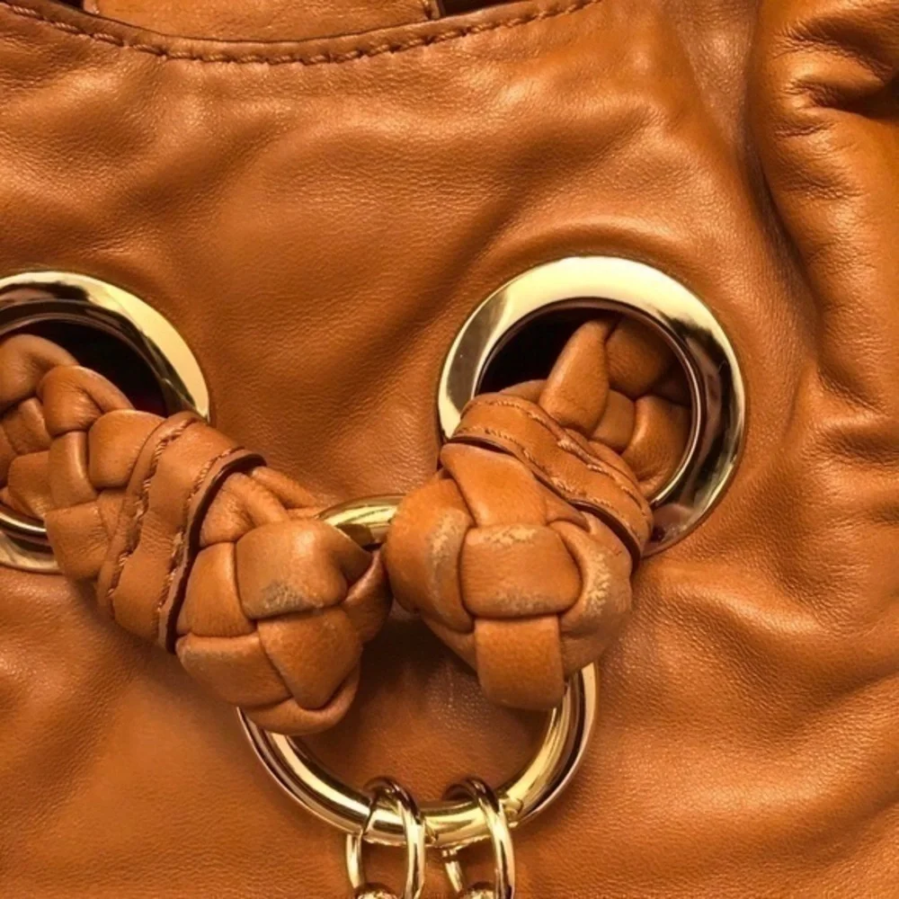Michael kors brown leather grommet tassel bag